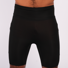 Load image into Gallery viewer, Black athletic shorts on a white background