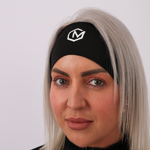 Load image into Gallery viewer, Person wearing a black headband with a logo on a plain background