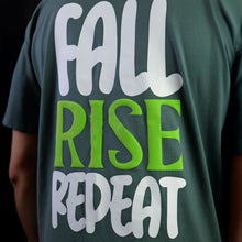 Load image into Gallery viewer, Green t-shirt with 'Fall Rise Repeat' text in white and green on a dark background