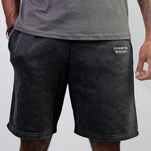 Load image into Gallery viewer, Person wearing black shorts with &#39;Champion Mindset&#39; logo on a gray background
