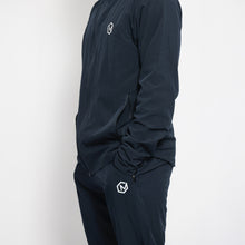 Load image into Gallery viewer, Dark blue athletic outfit with logos on a white background
